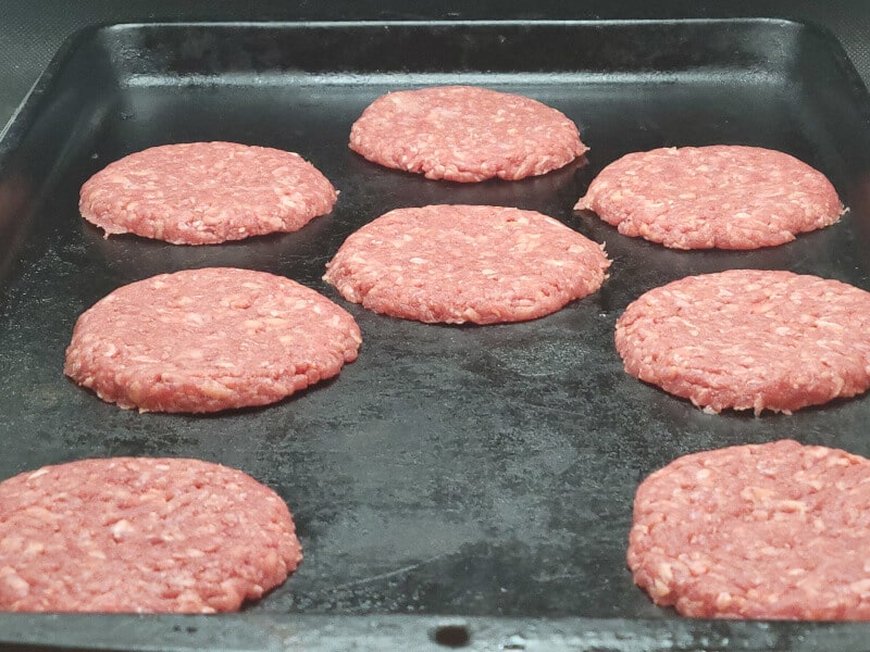 45g Beef Patties on a baking sheet ready to freeze