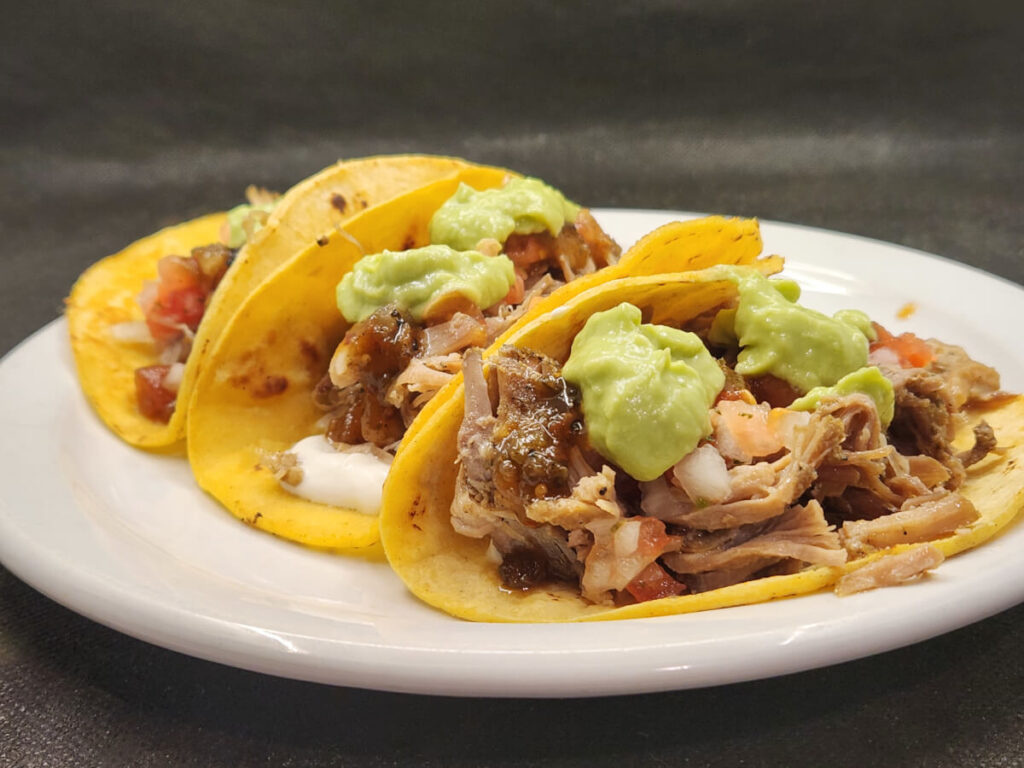 JAHZKITCHEN Carnitas Tacos with Sour Cream, Pico de Gallo, Quemada, and Guacamole