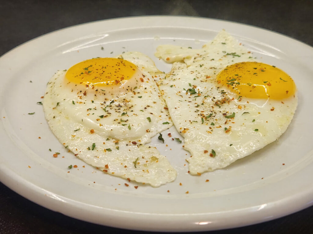 Sunny Side Up Eggs garnished with Parsley and Aleppo