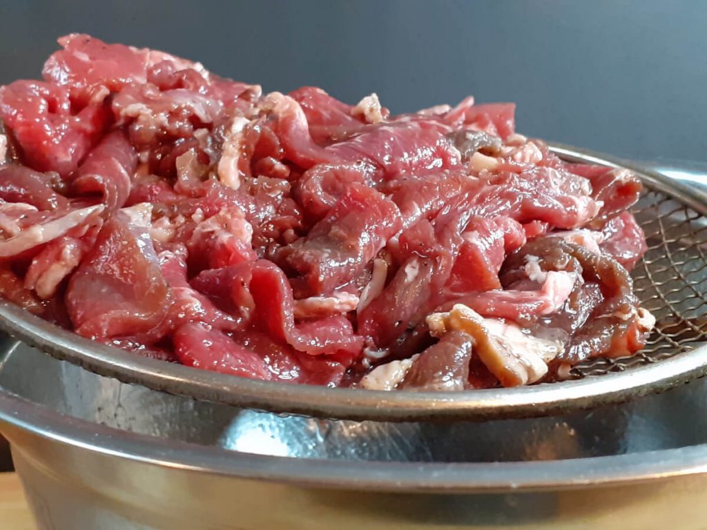 Marinated Thinly Sliced Steak in Meat Oil