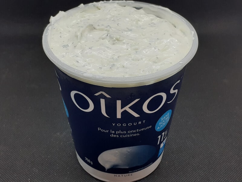 Tzatziki placed back into the yogurt container for storage