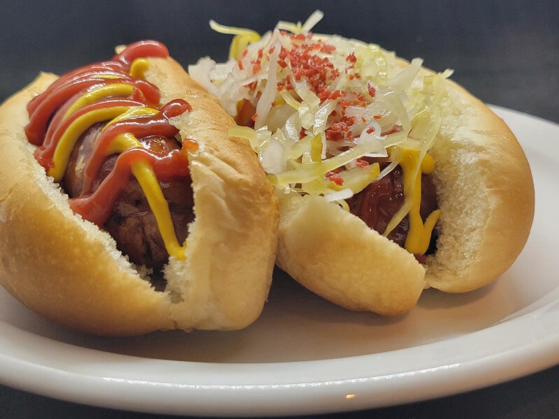 Oktoberfest Sausage with Ketchup Mustard Sauerkraut Bacon Bits