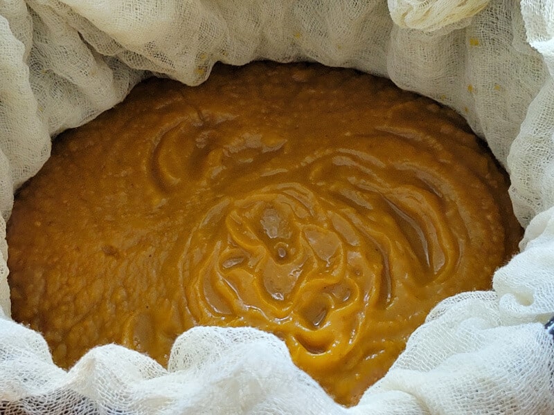 Blended Pumpkin straining with cheesecloth