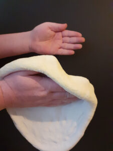 Slapping Pizza Dough