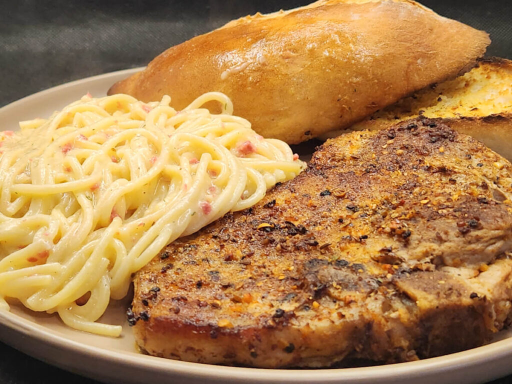 JAHZKITCHEN Garlic Butter Pasta with Bacon Bits, Seasoned Pork Chops and Bread Roll