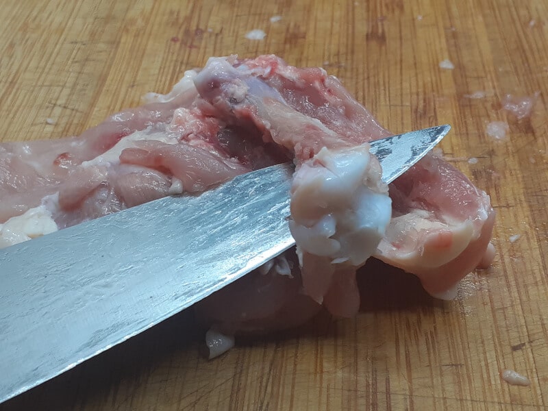 Chicken Thigh Slicing away the thigh bone