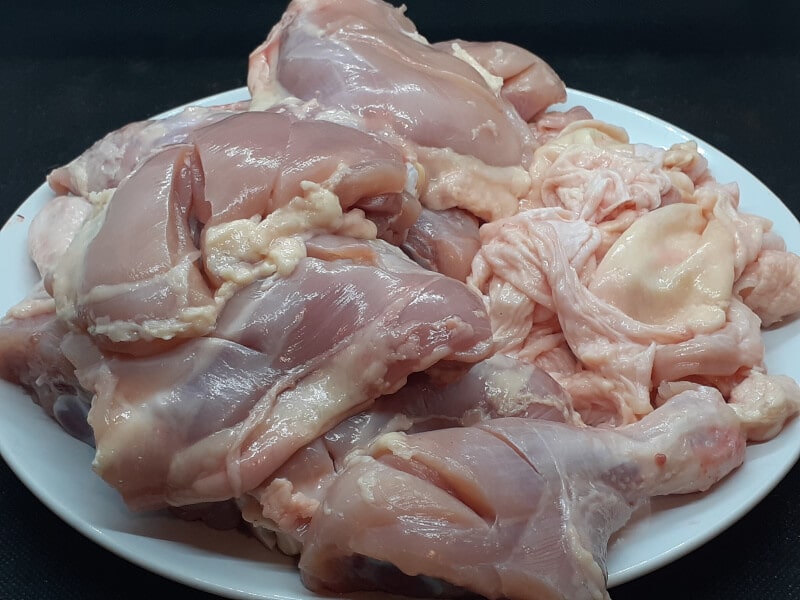 About 3 lbs of Skinless and Scored Chicken Quarters or 5 pieces
