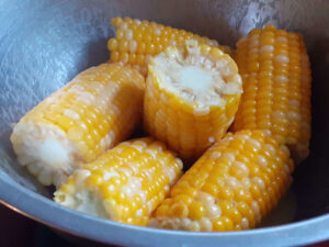 JAHZKITCHEN Tossing Corn on the Cob Halves in Corn Butter