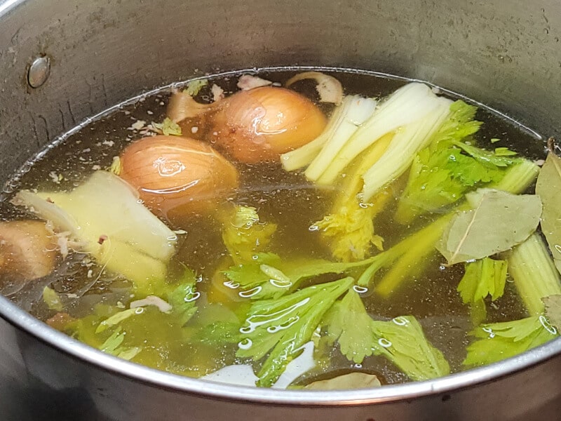 Reducing the Refrigerated Pork Broth with Aromatics