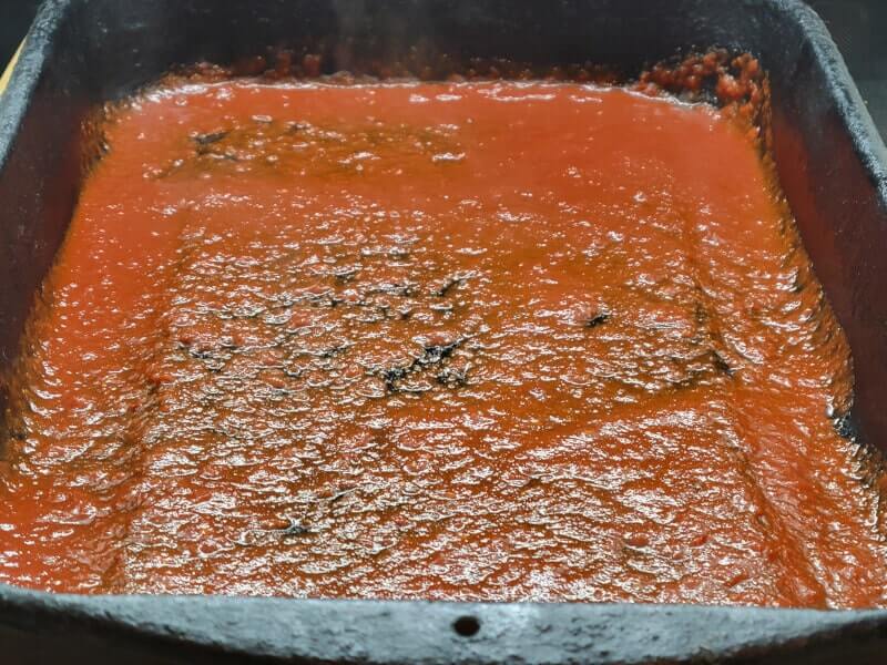 Enchilada Casserole coated in Enchilada Sauce