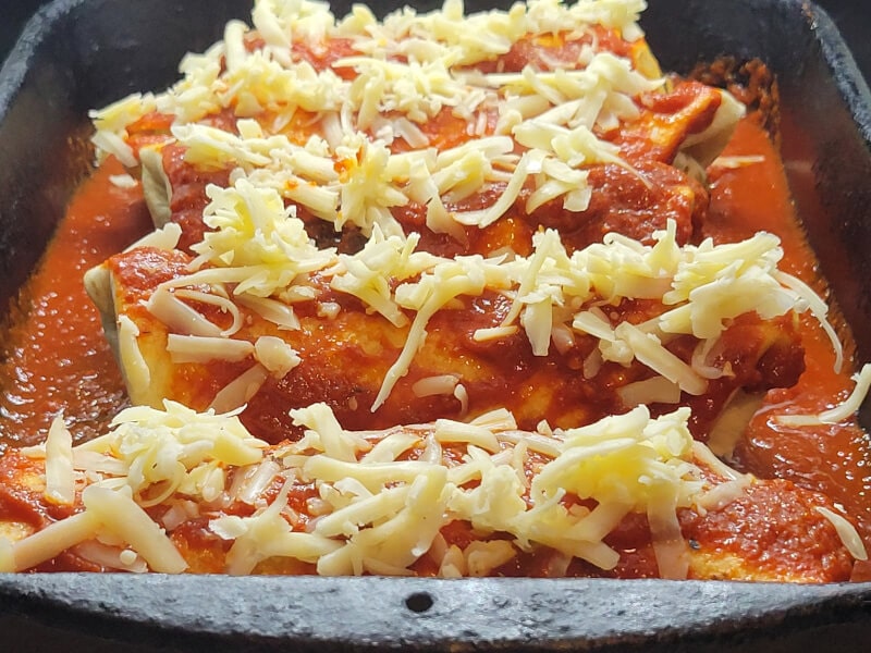 Enchiladas topped with Cheese