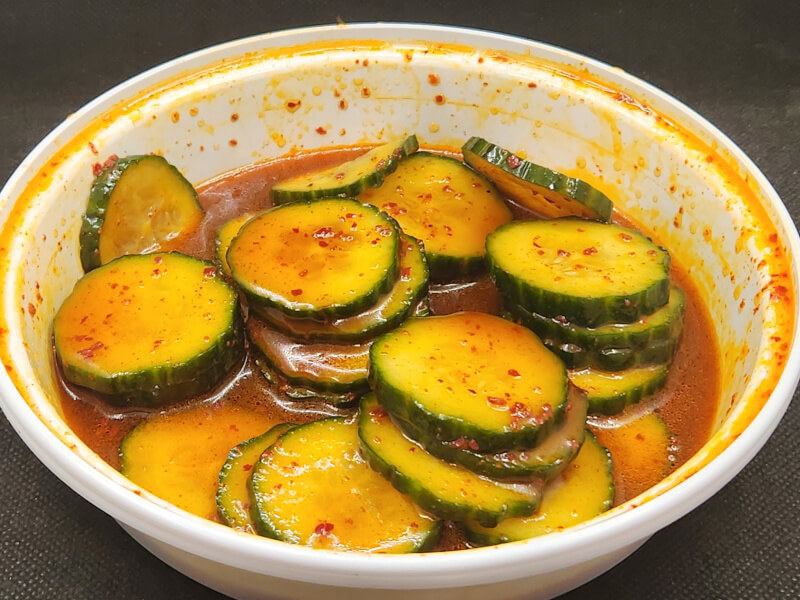 Korean Cucumbers stored in a tupperware bowl