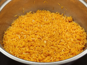 Steel bowl of Adobo Sazon Rice