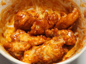JAHZKITCHEN Homemade Boneless Chicken Wings tossed in Chicken Plus Red Marvel Sauce