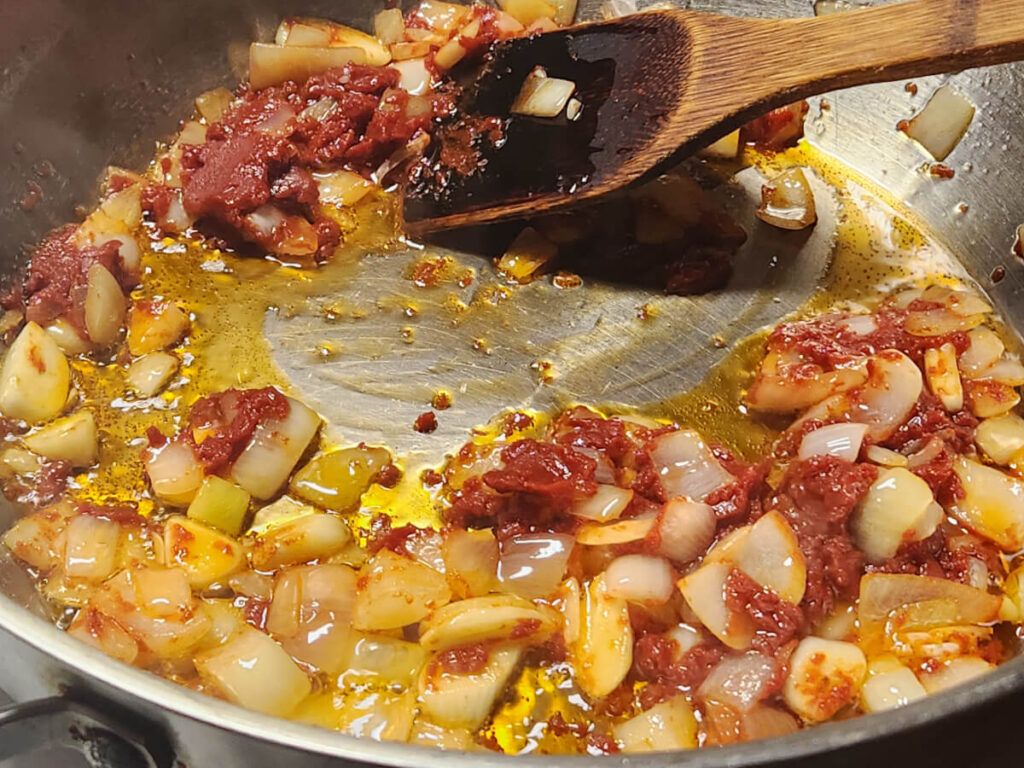 JAHZKITCHEN Mexican Rib Adobo adding Tomato Paste