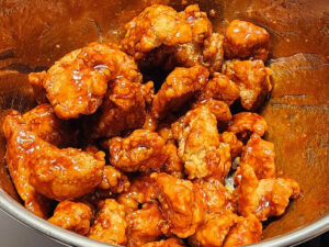 JAHZKITCHEN Tossing Boneless Chicken Wings in Red Marvel Style Sauce