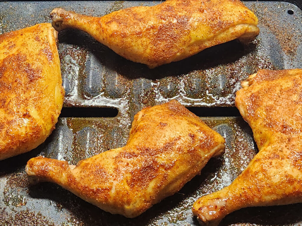 JAHZKITCHEN Adding more Rotisserie Seasoning to Chicken Quarters Skin side up