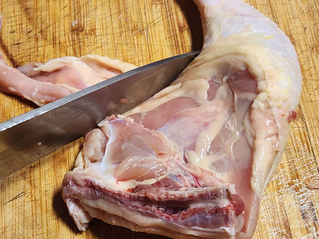 JAHZKITCHEN Trimming away excess skin from Chicken Quarters
