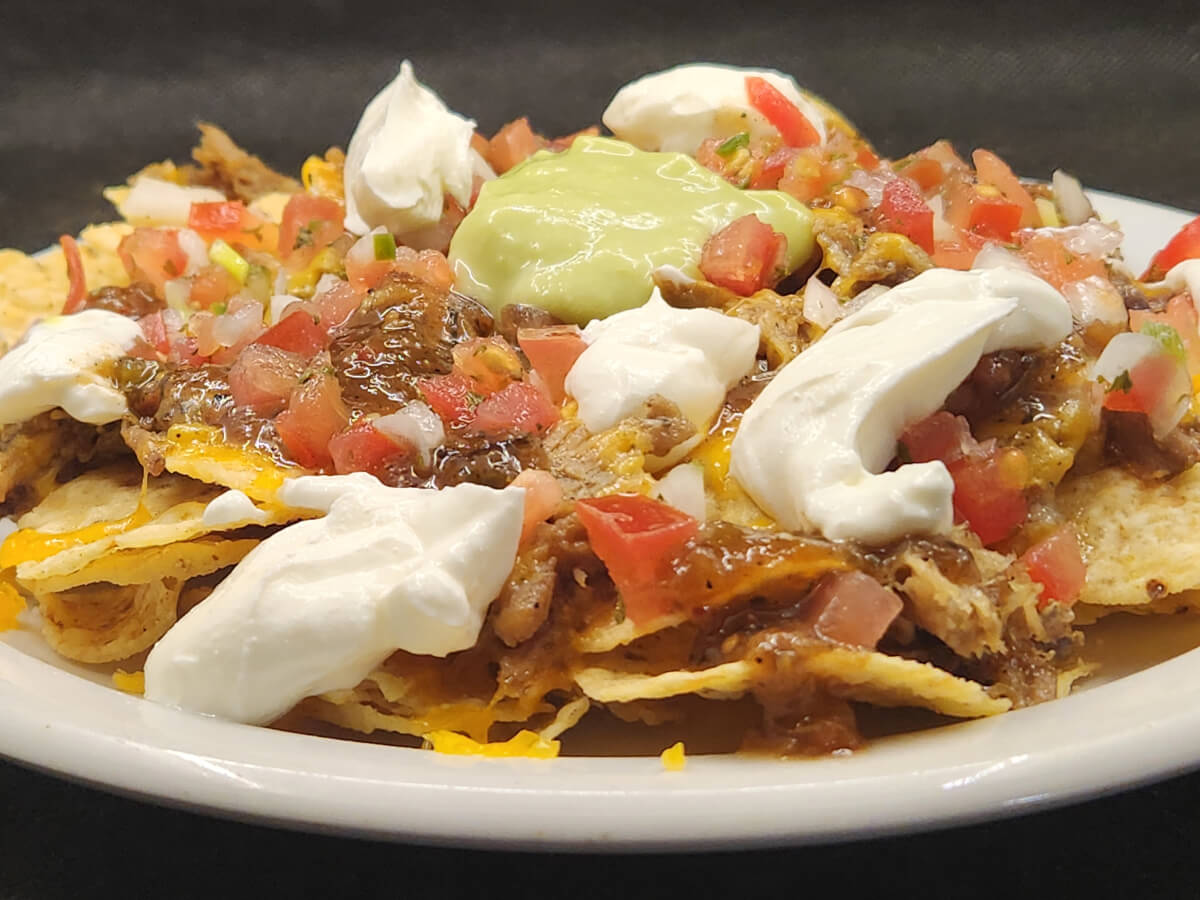 JAHZKITCHEN Carnitas Nachos with Cheese, Pico de Gallo, Poblano Salsa, Sour Cream and Guacamole