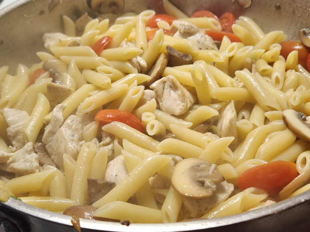 JAHZKITCHEN Twisty Sauce Pasta adding Parmigiano