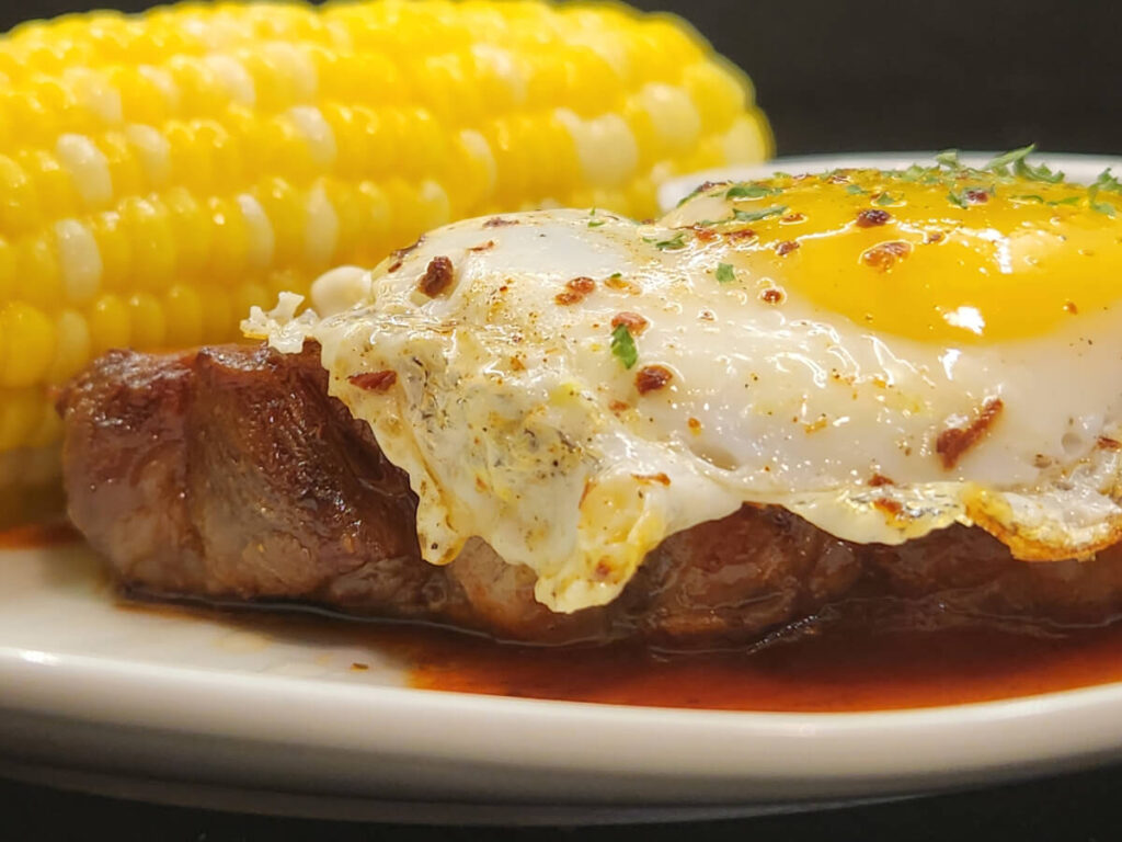 JAHZKITCHEN Closeup Pork Chops & Eggs with Rotisserie Pan Sauce and Corn in Corn Butter