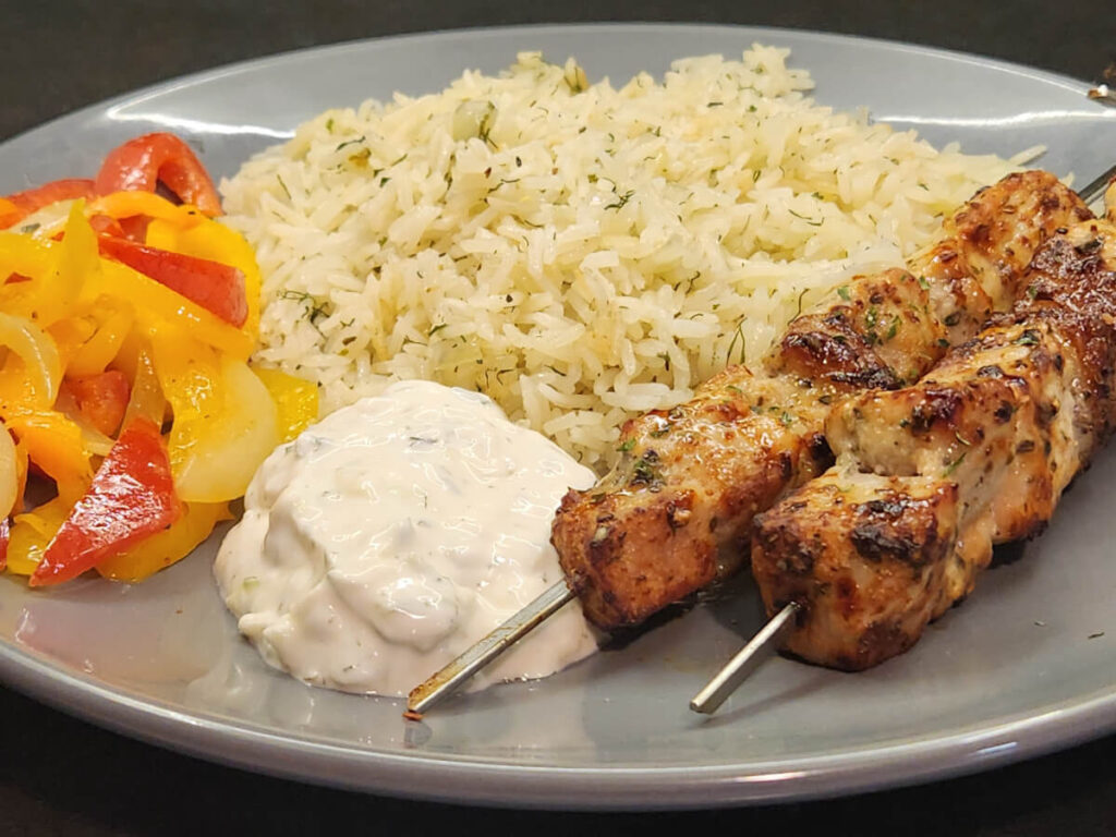 JAHZKITCHEN Pork Souvlaki with Lemon Rice Tzatziki and Sauteed Onions & Peppers