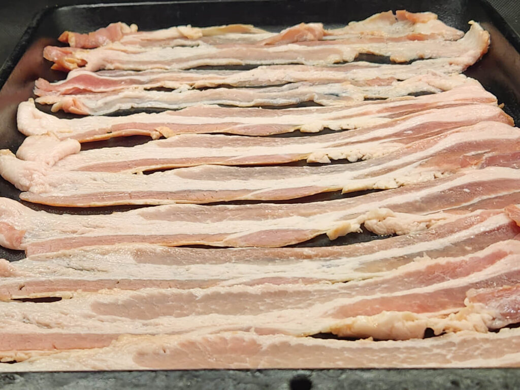 Whole package of Bacon on a Baking Sheet