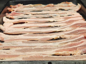 Whole package of Bacon on a Baking Sheet