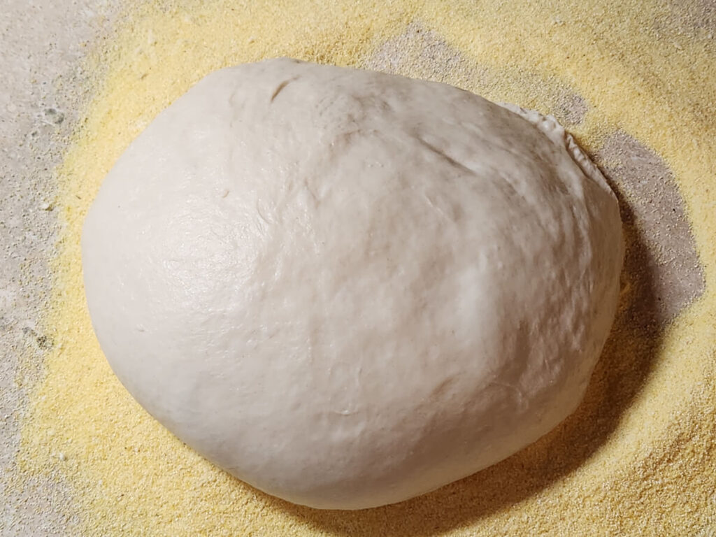 JAHZKITCHEN Pizza Dough on cornmeal dusted surface